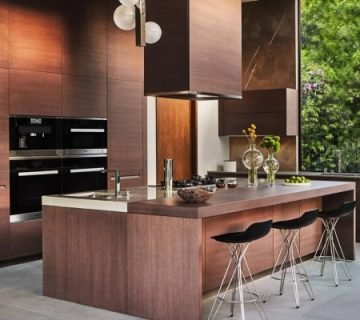 Modern Dubai kitchen with dark wood cabinets and island – Dubai kitchen cabinet materials